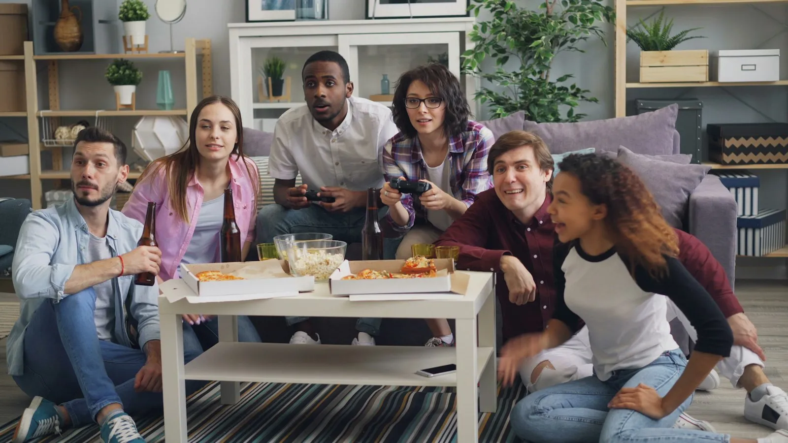Young roommates hanging out around a coffee table
