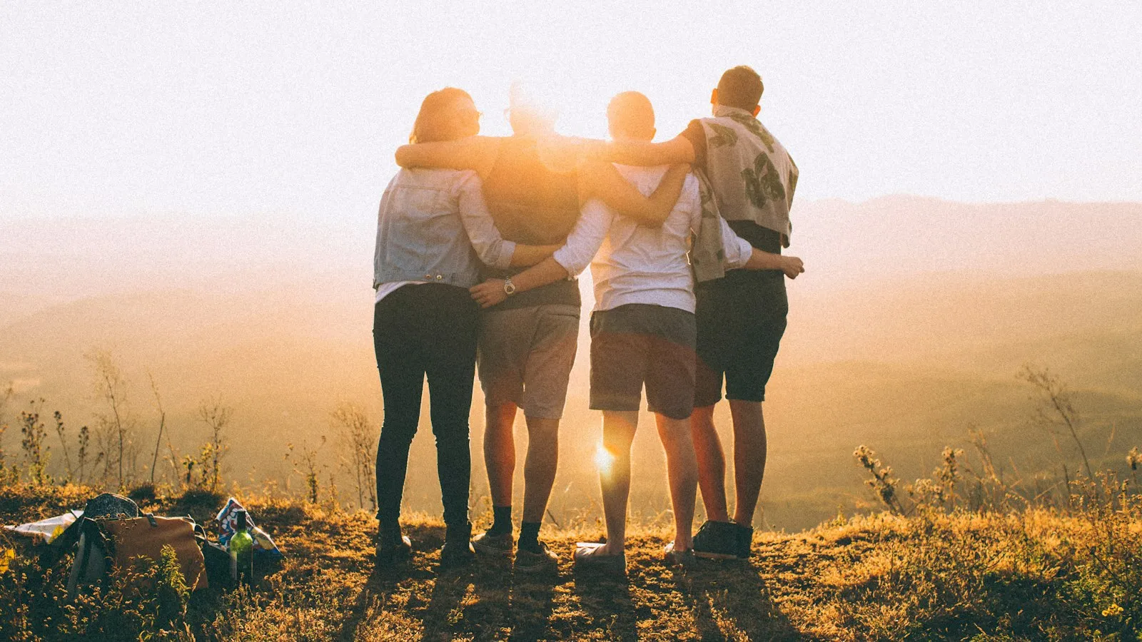 Friends with their arms around each other's shoulders