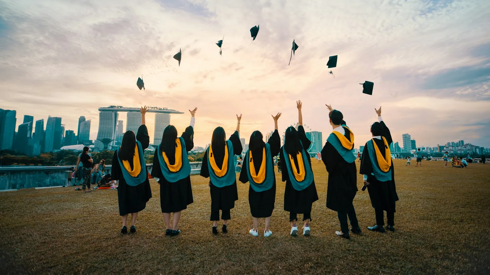 Graduates throwing their caps in the air