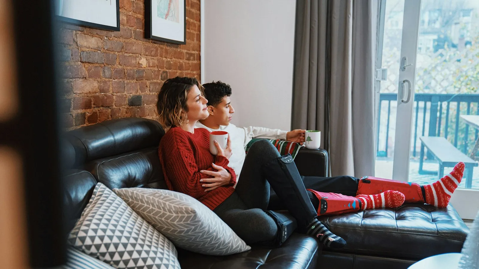 A couple sitting on a couch