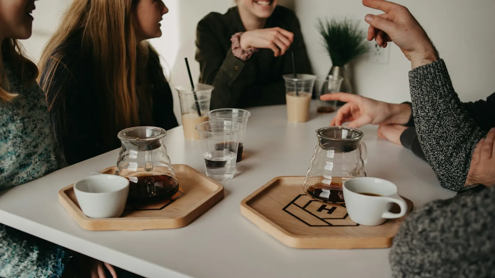 Friends talking around a table