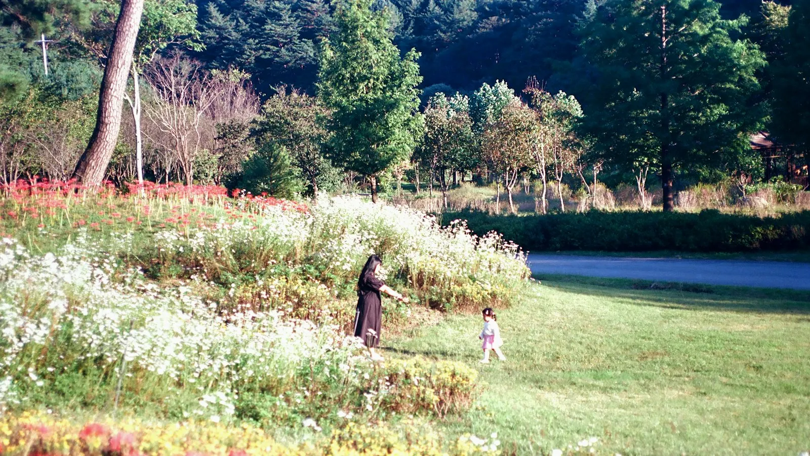 A mother and child in a field of flowers