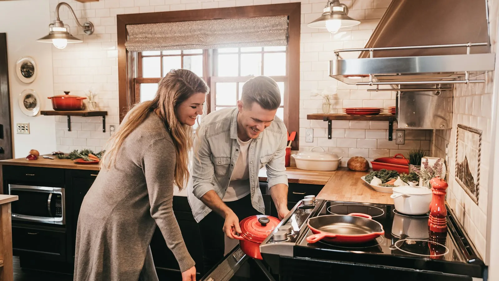 Two people cooking together in a kitchen