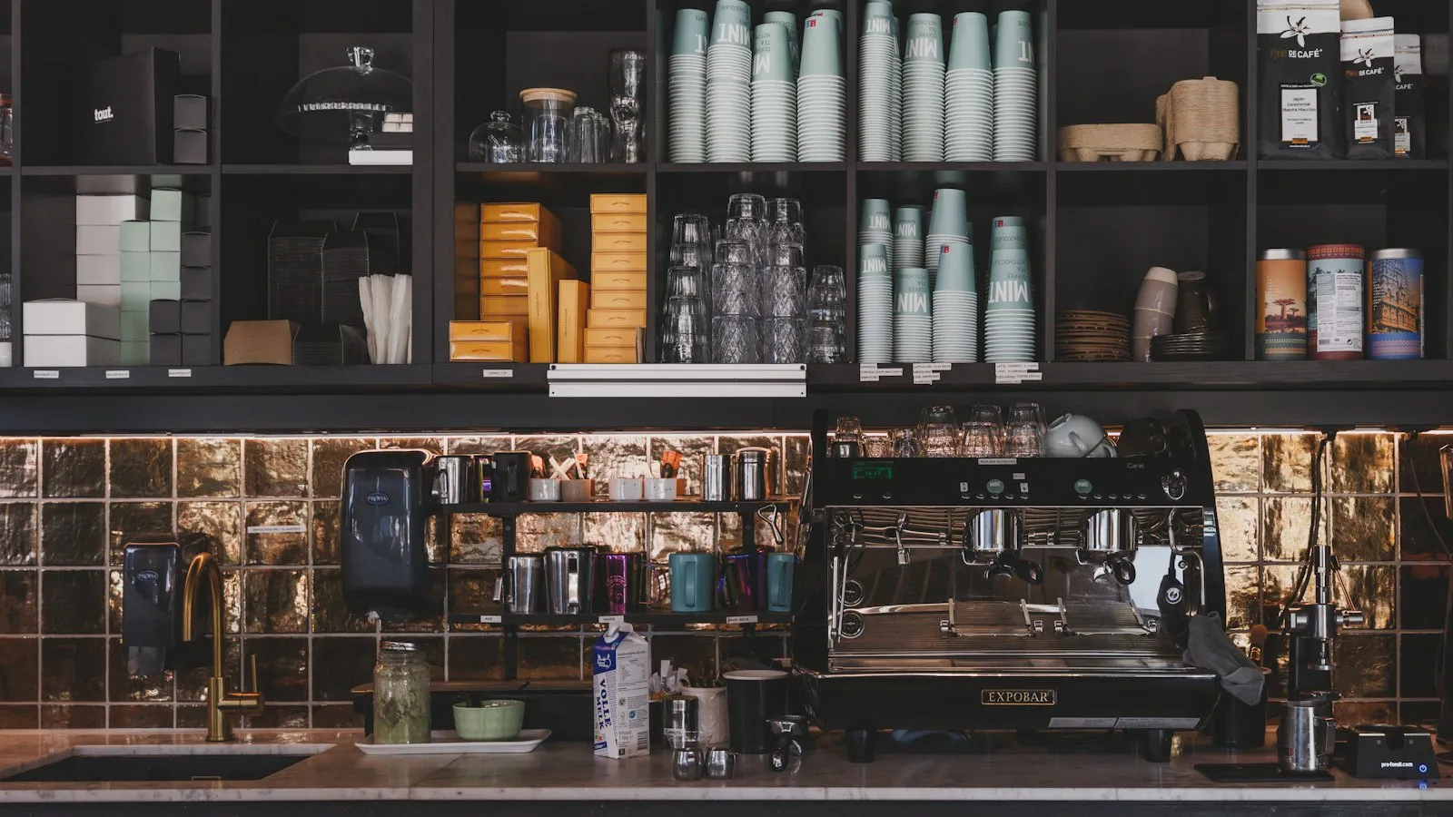 A coffee shop counter with an espresso machine